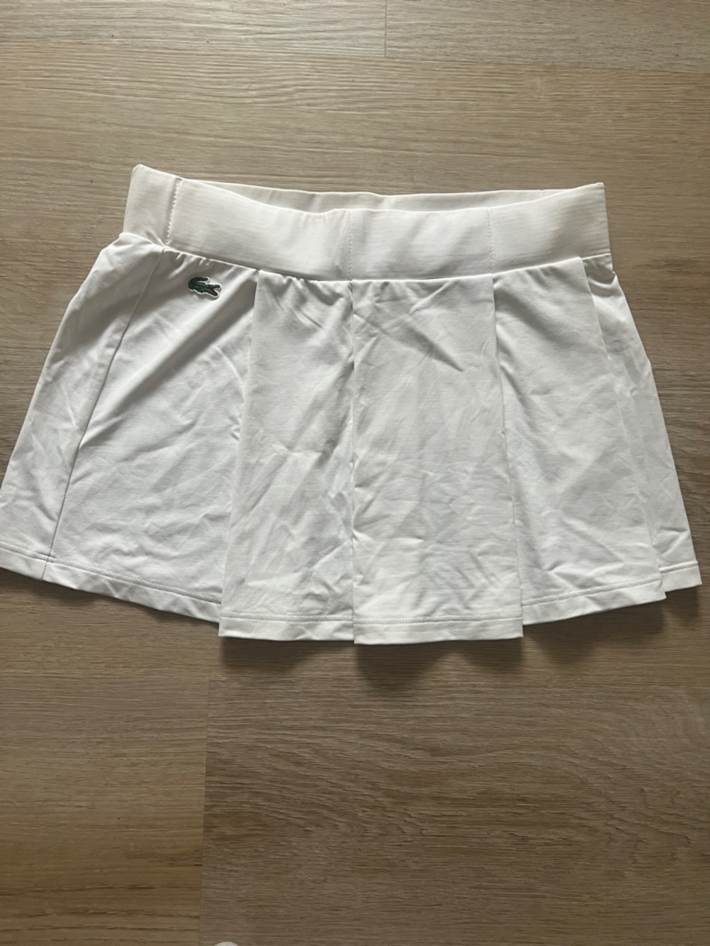 Lacoste White Pleated Athletic Skirt with Crocodile Logo.